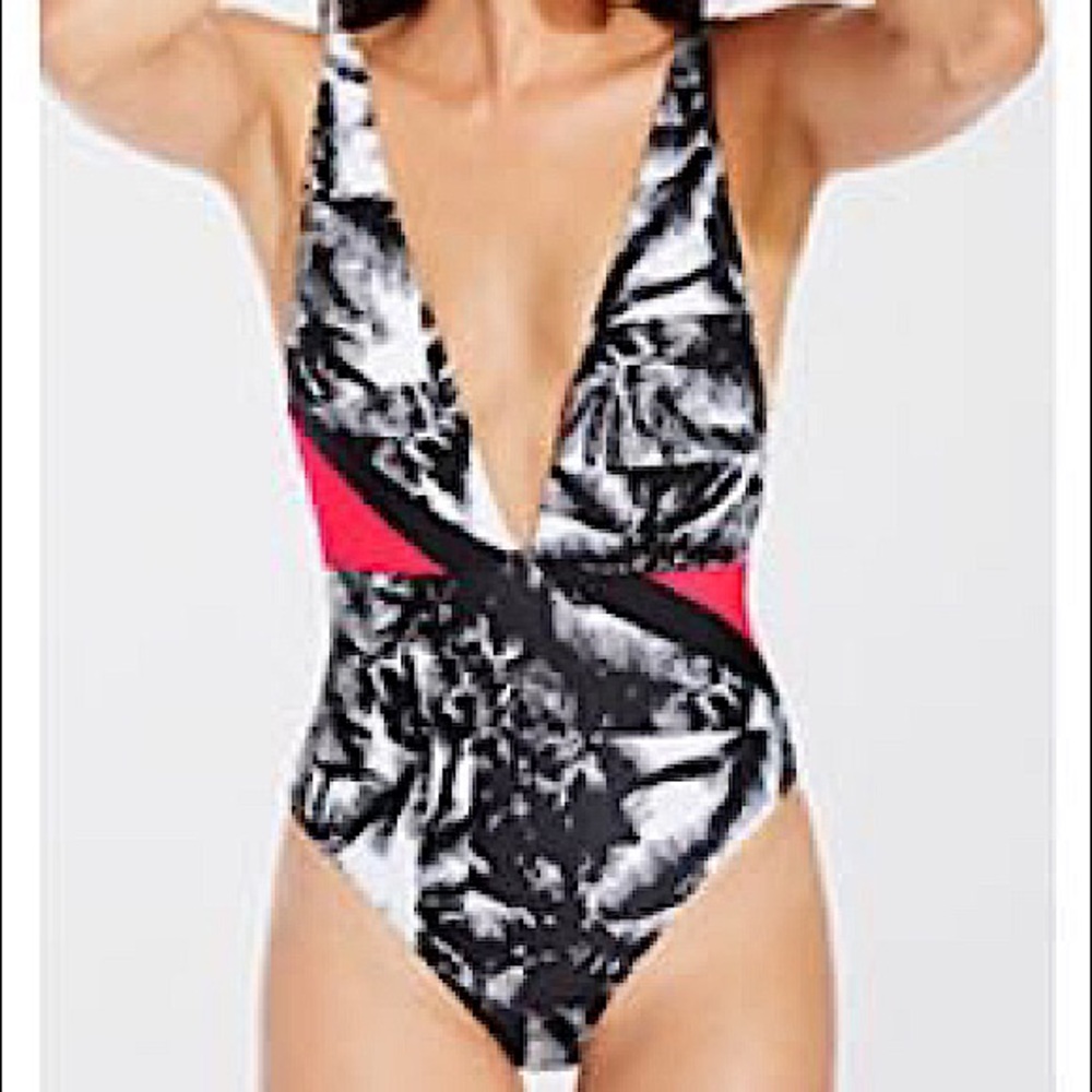 Black, white, pink one piece bathing suit.